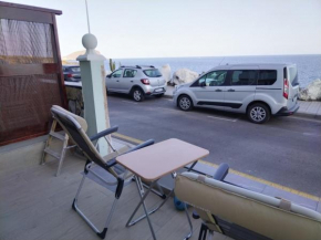 Mini house in front of the sea